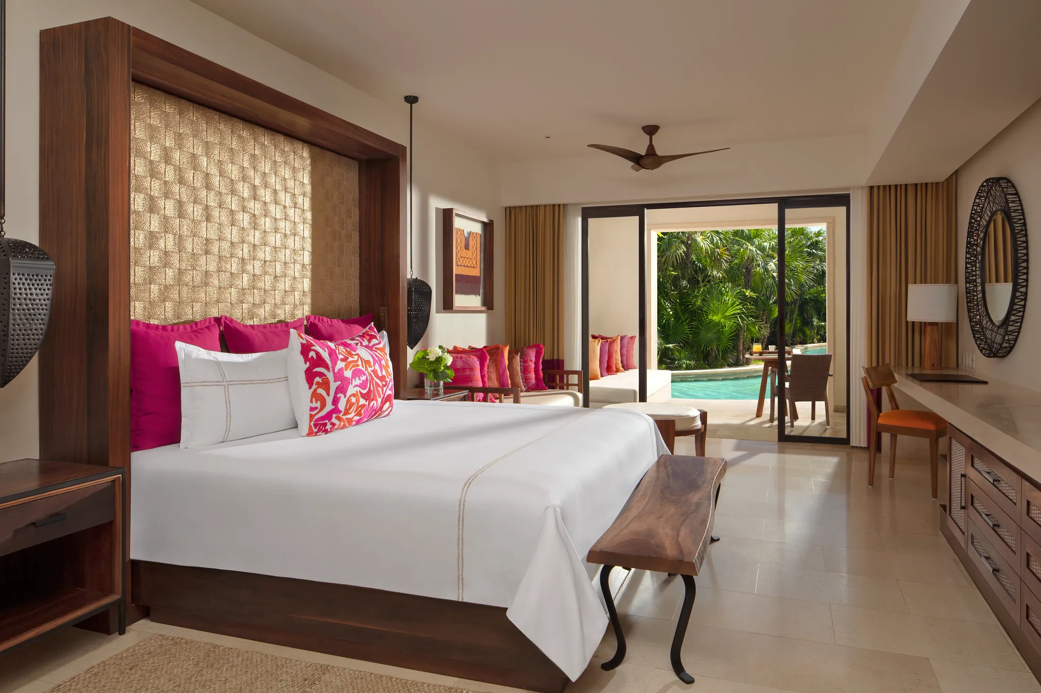 Junior Suite Ocean View with king bed and sitting area at Secrets Akumal Riviera Maya with balcony access.