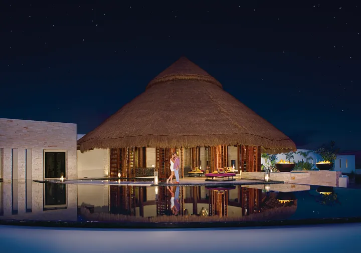 secrets-akumal-lobby-mirror-fountain-night-couple